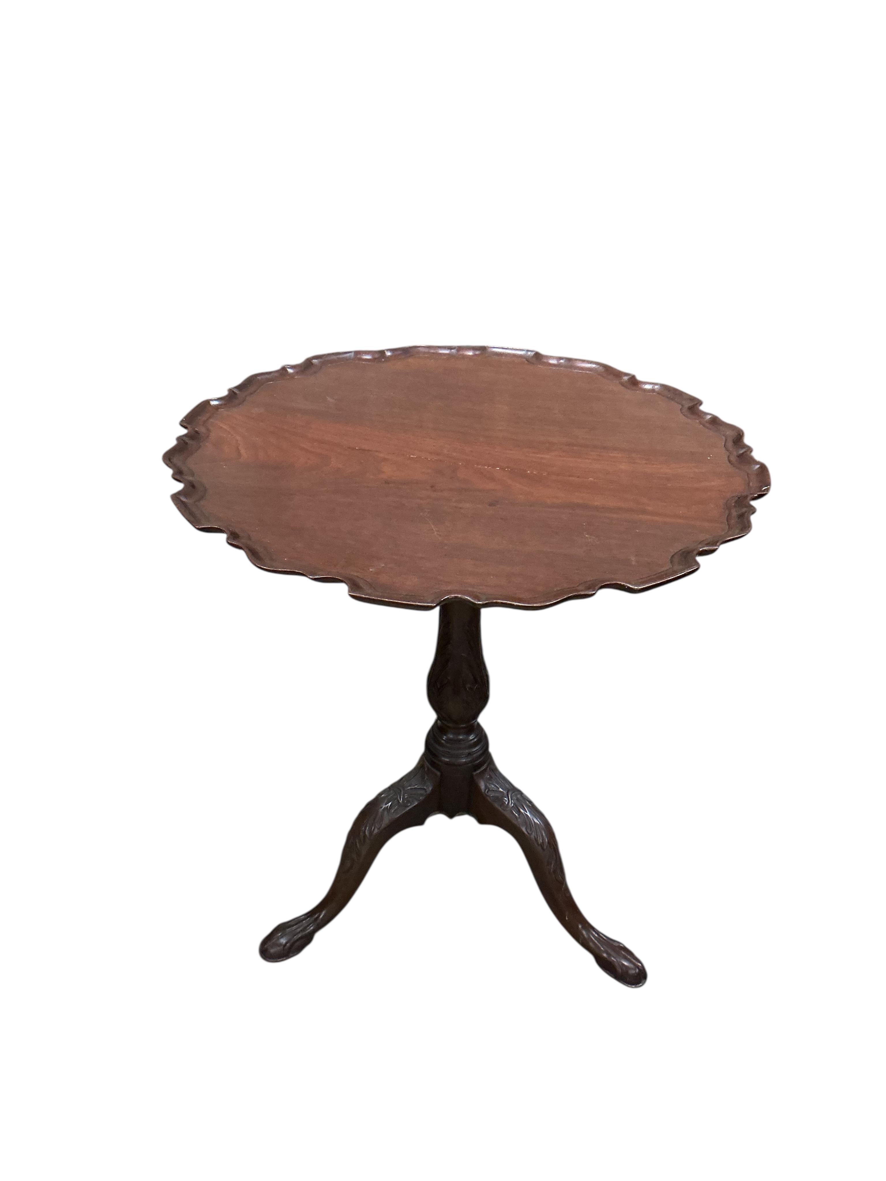 A George III circular mahogany piecrust tilt top bird cage tripod tea table, diameter 64cm, height 71cm (repair to top)